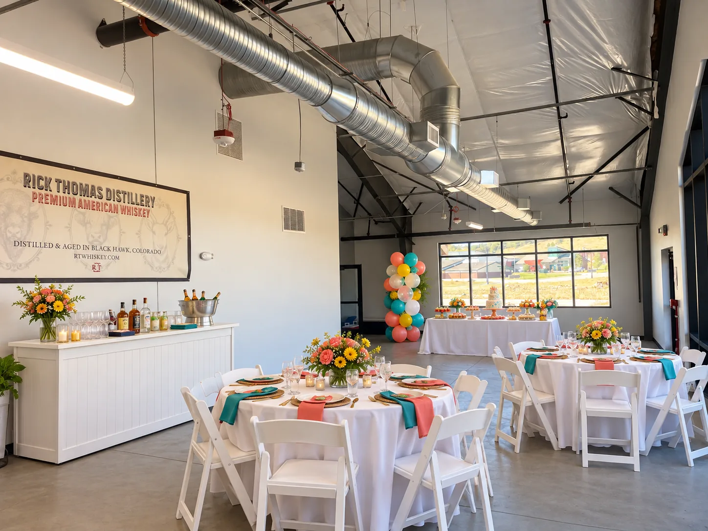 Celebration tables decorated with flowers and balloons